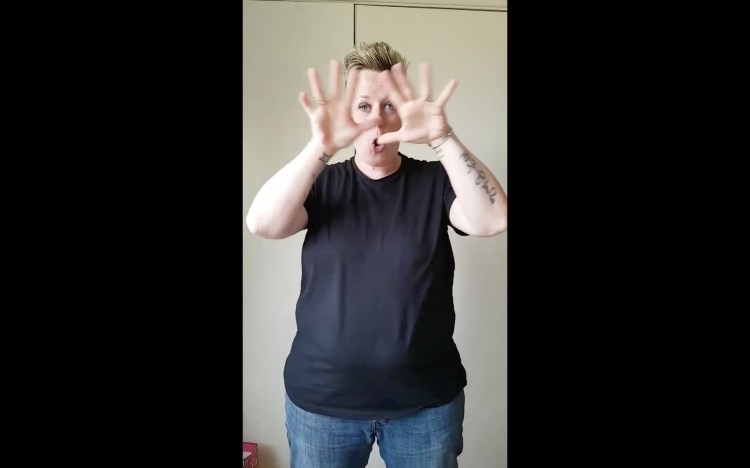 Laura Denning_Still 2 from BSL Training Video featuring Fletch the Deaf Popstar (who also translated the material into BSL)